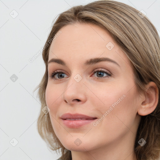 Joyful white young-adult female with long  brown hair and grey eyes