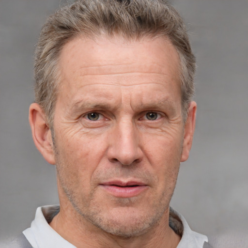 Neutral white middle-aged male with short  brown hair and grey eyes