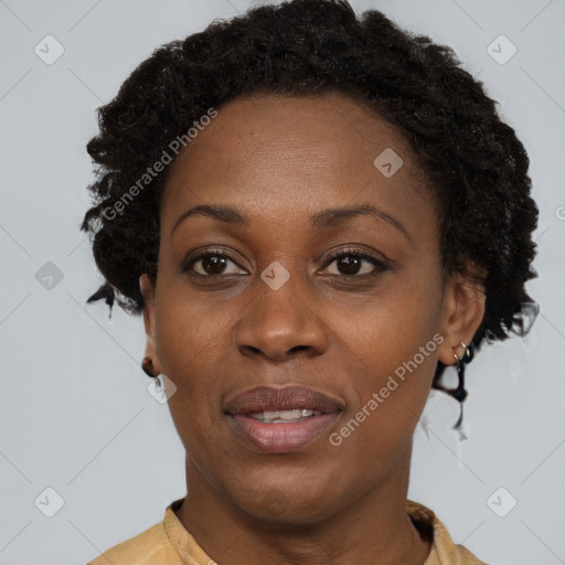 Joyful black adult female with short  brown hair and brown eyes