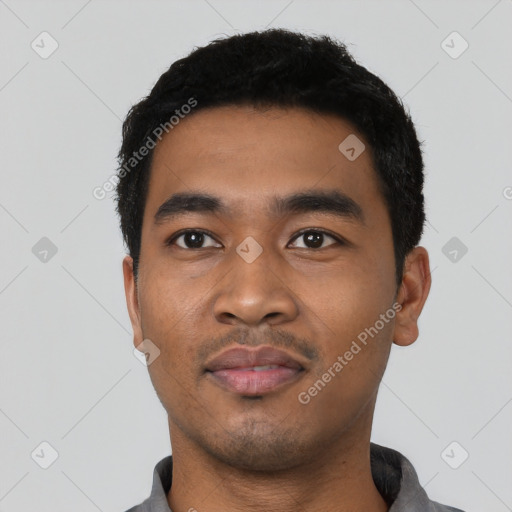 Neutral latino young-adult male with short  black hair and brown eyes