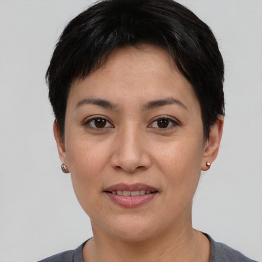 Joyful white young-adult female with short  black hair and brown eyes