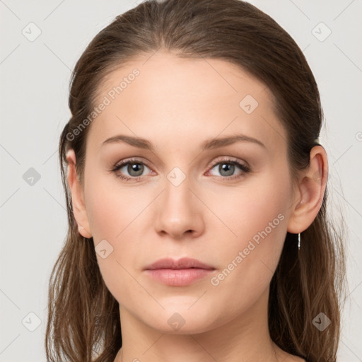 Neutral white young-adult female with long  brown hair and brown eyes