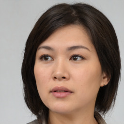 Neutral asian young-adult female with medium  brown hair and brown eyes