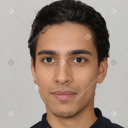 Neutral latino young-adult male with short  black hair and brown eyes