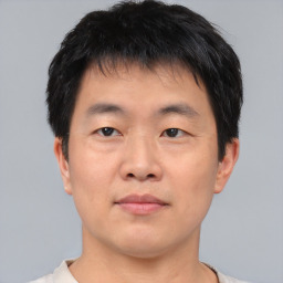 Neutral asian young-adult male with short  brown hair and brown eyes