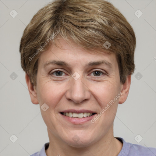 Joyful white adult male with short  brown hair and grey eyes