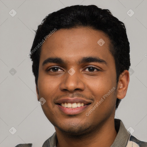 Joyful latino young-adult male with short  black hair and brown eyes