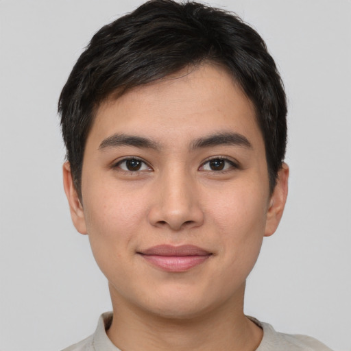 Joyful asian young-adult male with short  brown hair and brown eyes