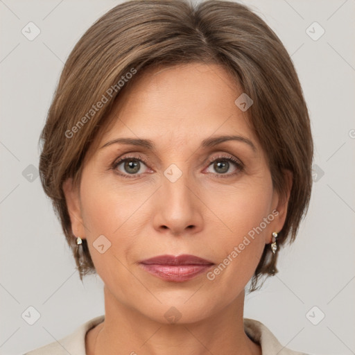 Joyful white adult female with medium  brown hair and grey eyes