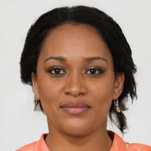 Joyful black adult female with medium  black hair and brown eyes