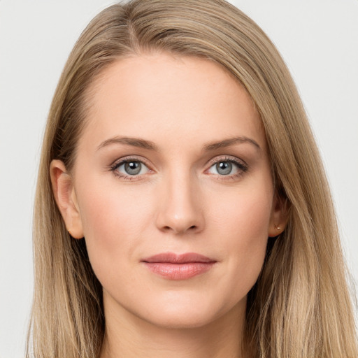 Joyful white young-adult female with long  brown hair and grey eyes