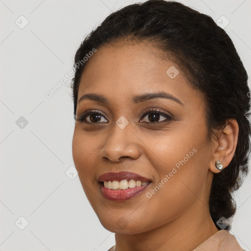 Joyful latino young-adult female with medium  brown hair and brown eyes