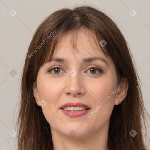 Joyful white adult female with long  brown hair and brown eyes