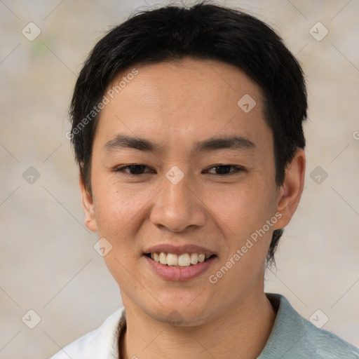 Joyful asian young-adult male with short  black hair and brown eyes