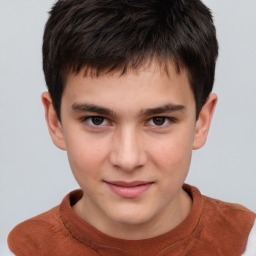 Joyful white child male with short  brown hair and brown eyes