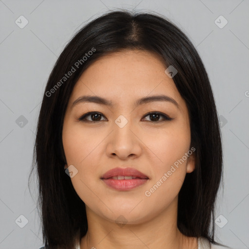 Joyful latino young-adult female with long  brown hair and brown eyes