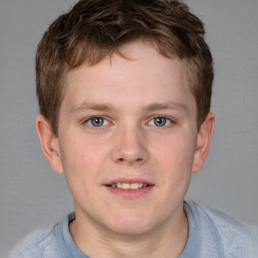 Joyful white young-adult male with short  brown hair and blue eyes