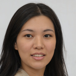 Joyful asian young-adult female with long  brown hair and brown eyes