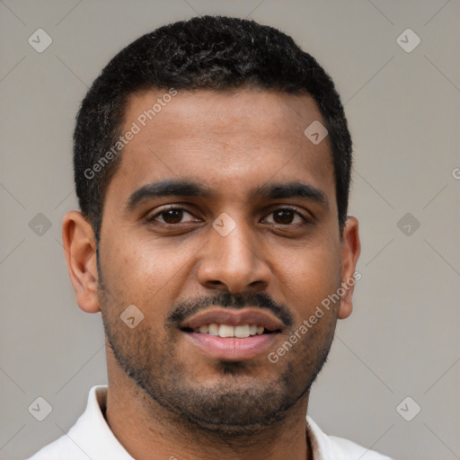 Joyful black young-adult male with short  brown hair and brown eyes