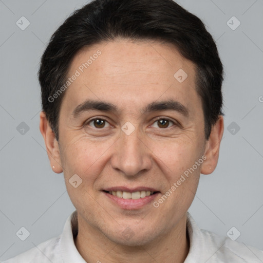 Joyful white adult male with short  brown hair and brown eyes