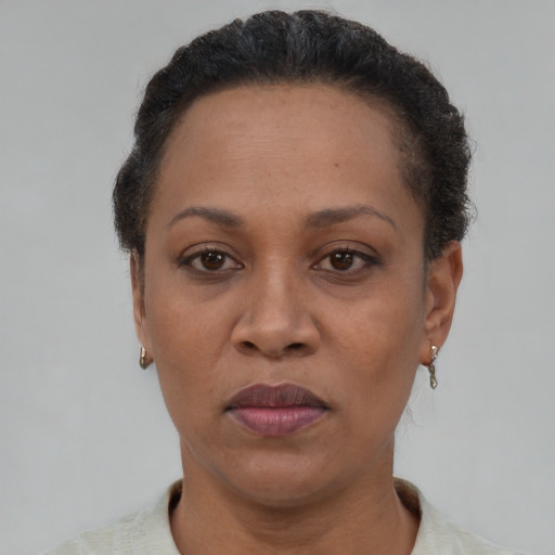 Neutral black adult female with short  brown hair and brown eyes