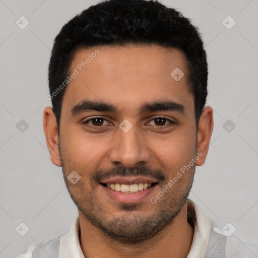 Joyful latino young-adult male with short  black hair and brown eyes