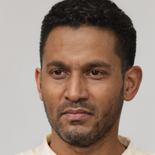 Neutral latino adult male with short  black hair and brown eyes