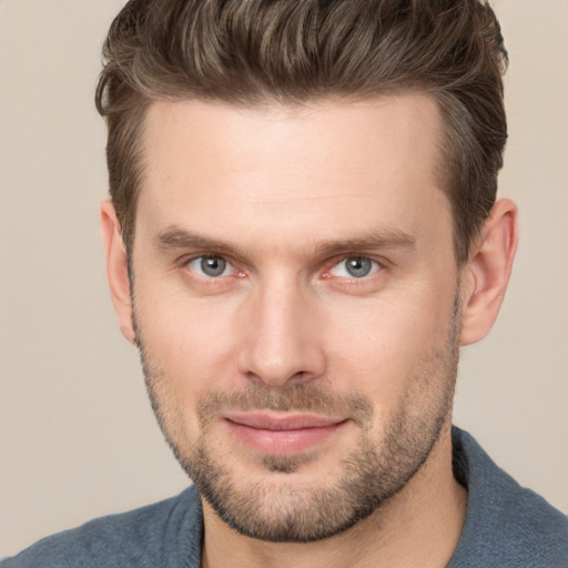 Joyful white young-adult male with short  brown hair and brown eyes