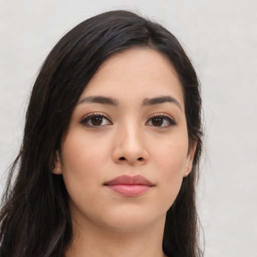 Joyful asian young-adult female with long  brown hair and brown eyes