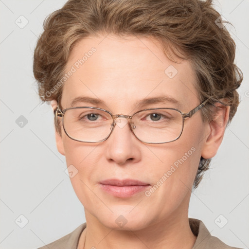 Joyful white adult female with short  brown hair and grey eyes