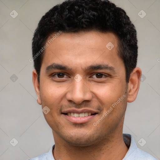 Joyful latino young-adult male with short  black hair and brown eyes