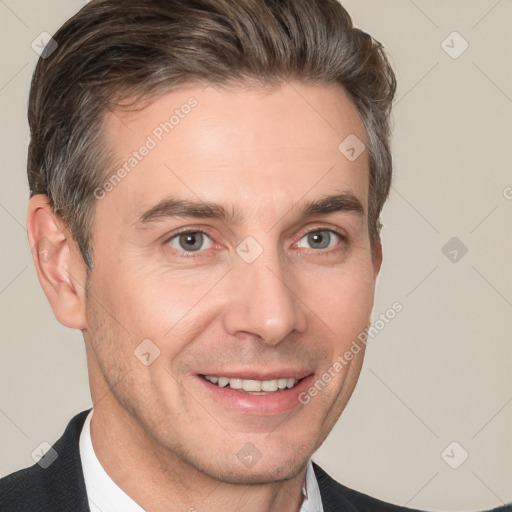 Joyful white adult male with short  brown hair and brown eyes