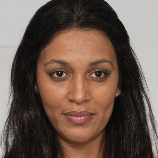 Joyful asian adult female with long  brown hair and brown eyes