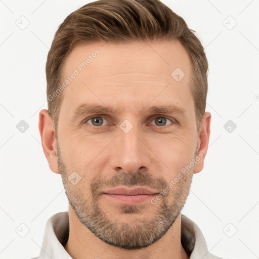 Joyful white adult male with short  brown hair and grey eyes