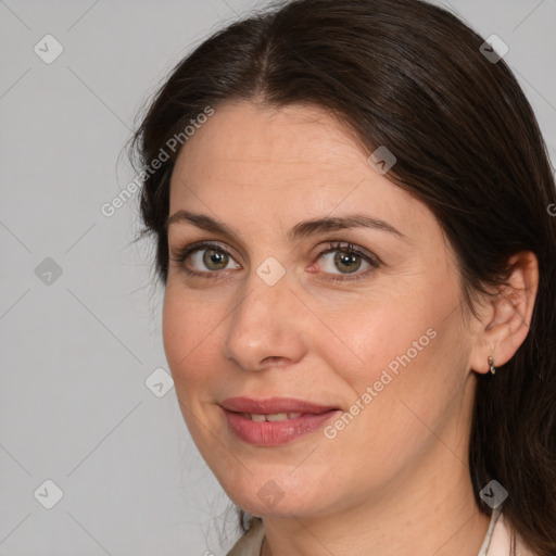 Joyful white adult female with medium  brown hair and brown eyes