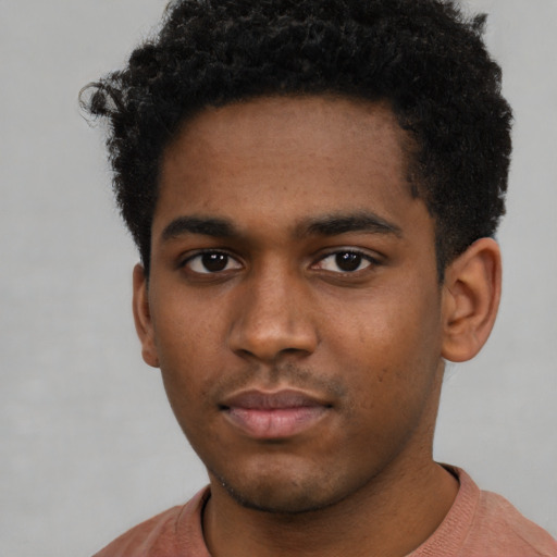 Neutral black young-adult male with short  brown hair and brown eyes