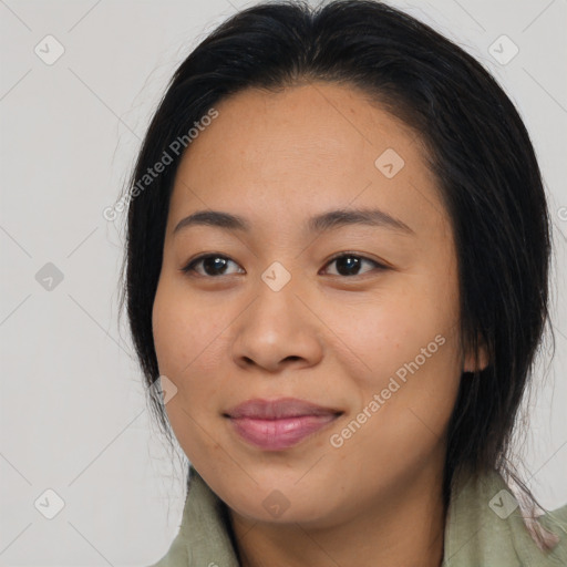 Joyful asian young-adult female with long  brown hair and brown eyes