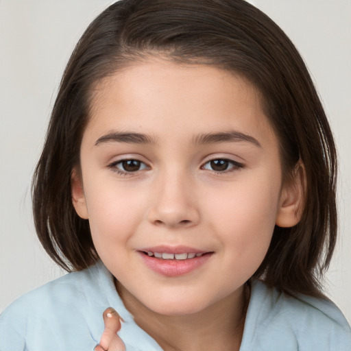 Joyful white child female with medium  brown hair and brown eyes