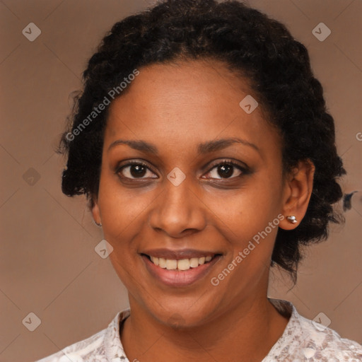 Joyful black young-adult female with medium  black hair and brown eyes