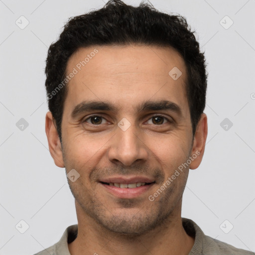 Joyful white young-adult male with short  black hair and brown eyes