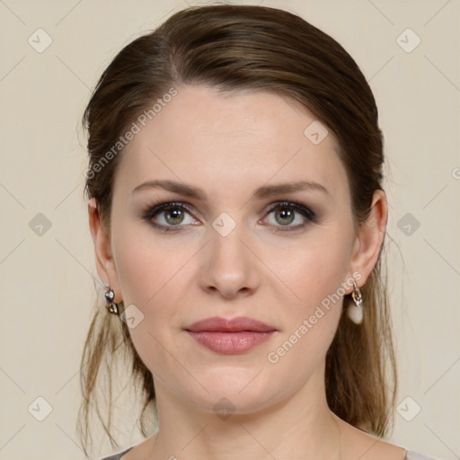 Joyful white young-adult female with medium  brown hair and green eyes