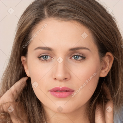 Neutral white young-adult female with long  brown hair and brown eyes