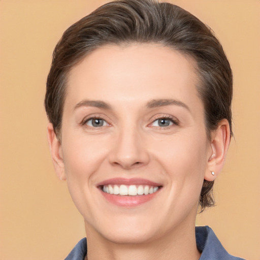 Joyful white young-adult female with medium  brown hair and brown eyes