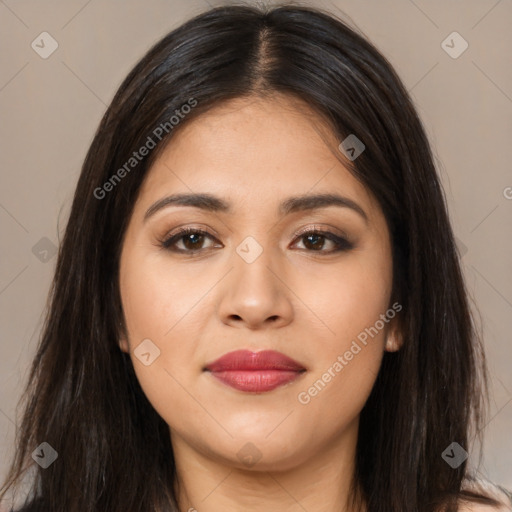 Joyful latino young-adult female with long  brown hair and brown eyes