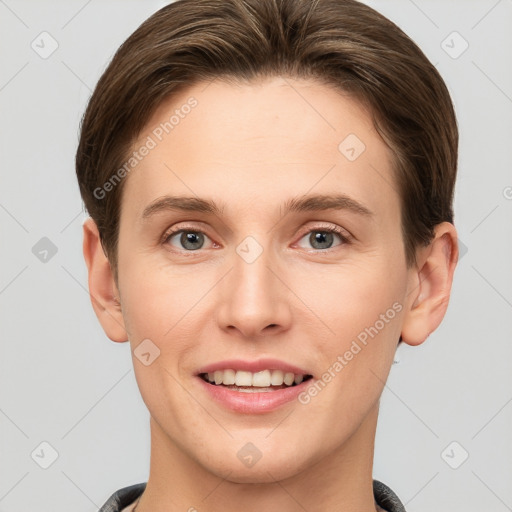 Joyful white young-adult female with short  brown hair and grey eyes