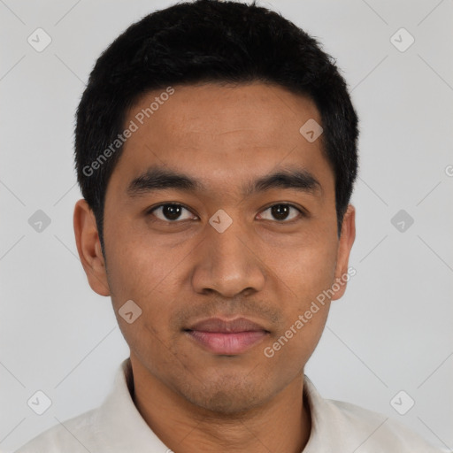 Joyful asian young-adult male with short  black hair and brown eyes