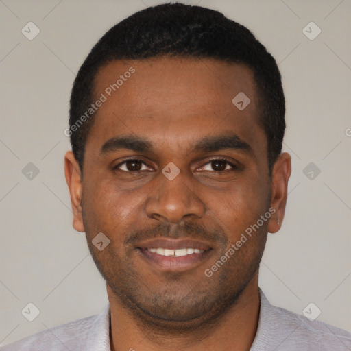 Joyful black young-adult male with short  black hair and brown eyes