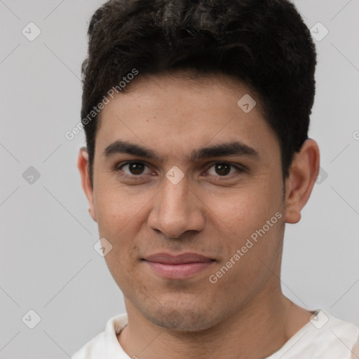 Joyful white young-adult male with short  black hair and brown eyes