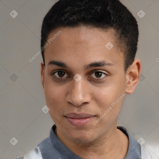 Joyful latino young-adult male with short  brown hair and brown eyes