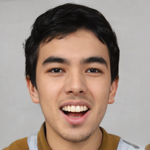 Joyful asian young-adult male with short  black hair and brown eyes